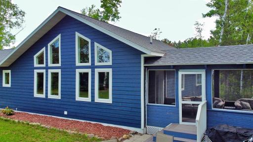 Home with view of screen porch entrance.jpg
