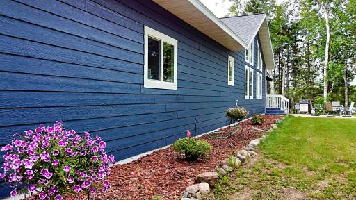 Side view entrance of home with landscaping.jpg