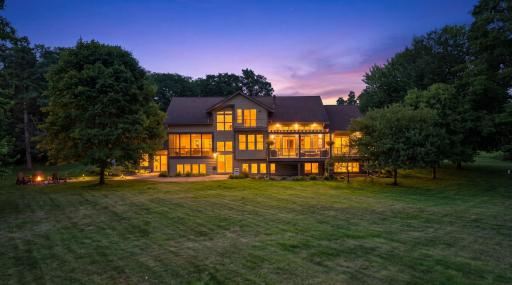 Set on 2.8 private wooded acres, this remarkable residence showcases over 6,000 square feet of exceptional living space where timeless craftsmanship, expansive gathering areas, soaring ceilings, and walls of windows.