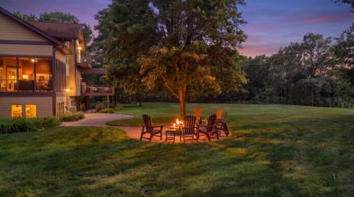 Outside, beautifully landscaped grounds surround a spacious yard with endless room for outdoor games, gatherings, and recreation.