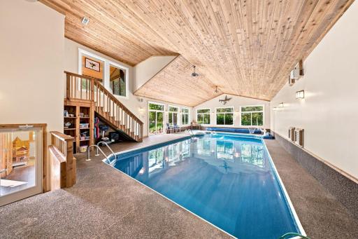 A true highlight of the home is the spectacular indoor pool and hot tub, creating a private year-round retreat unlike anything else.