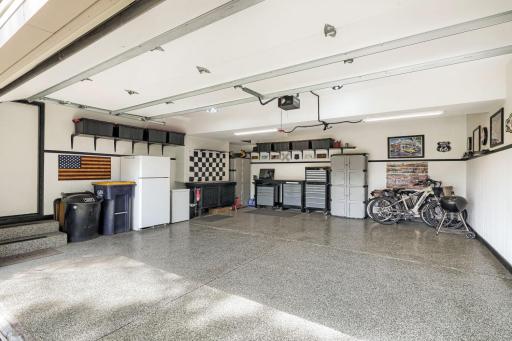 Beautiful garage with epoxy floors and finished walls.