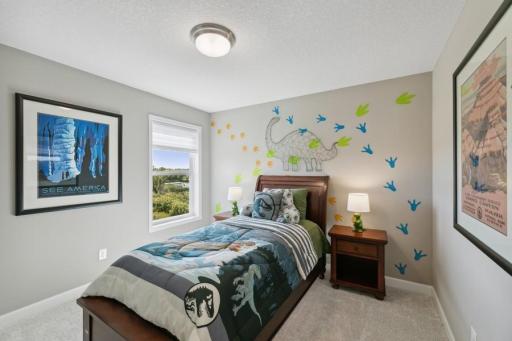 (Photo of decorated model, colors and features will vary) The first of three secondary bedrooms.