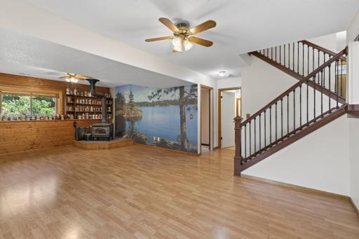 LL large family room with wood burning fireplace.