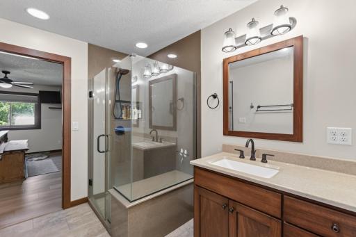 Primary en-suite has oversized luxury shower with seat