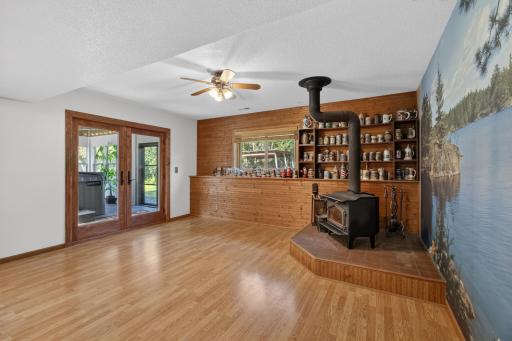Family room walks out to 3 season porch with hot tub.