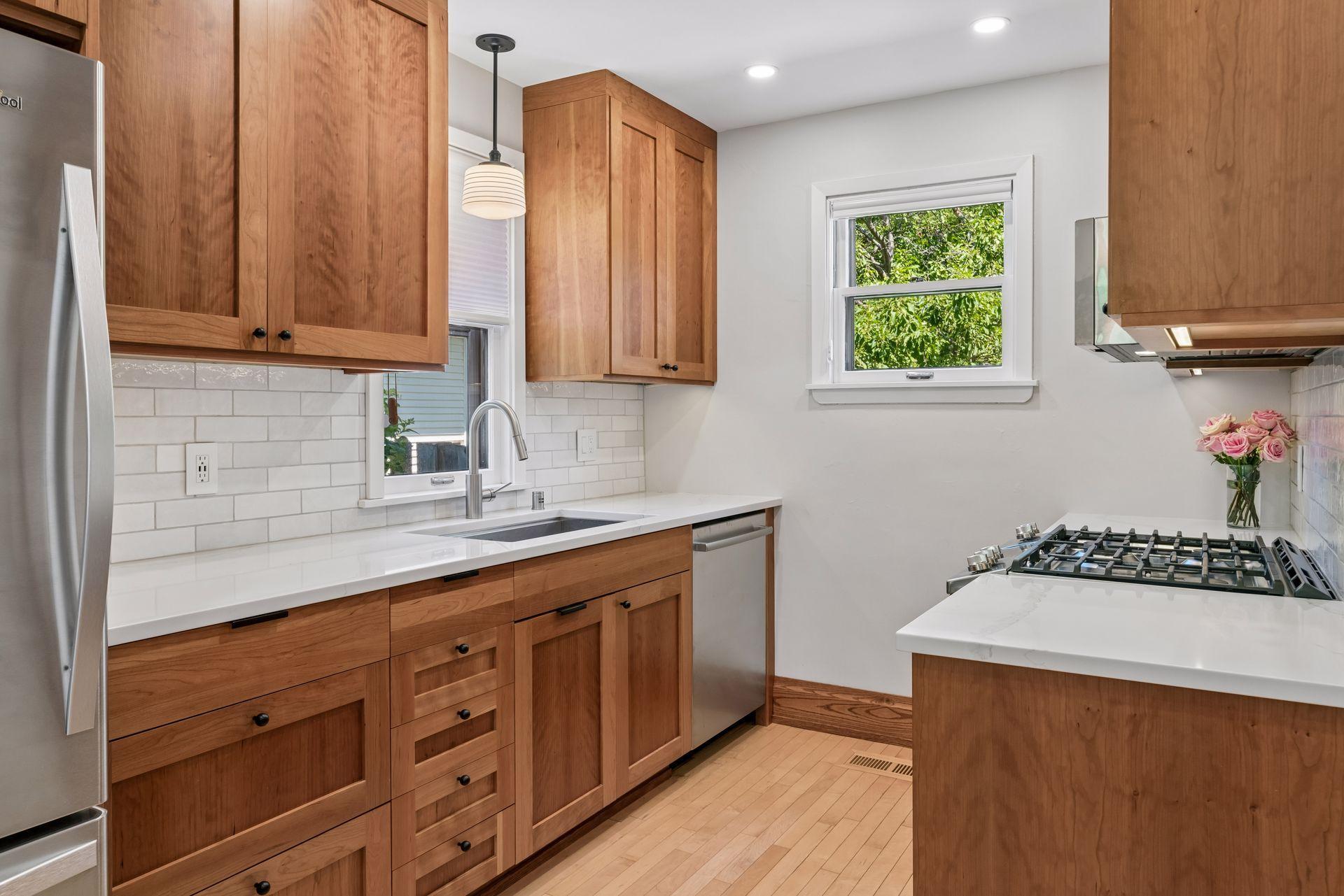 Ceiling-height cherry cabinets, GE gas range...