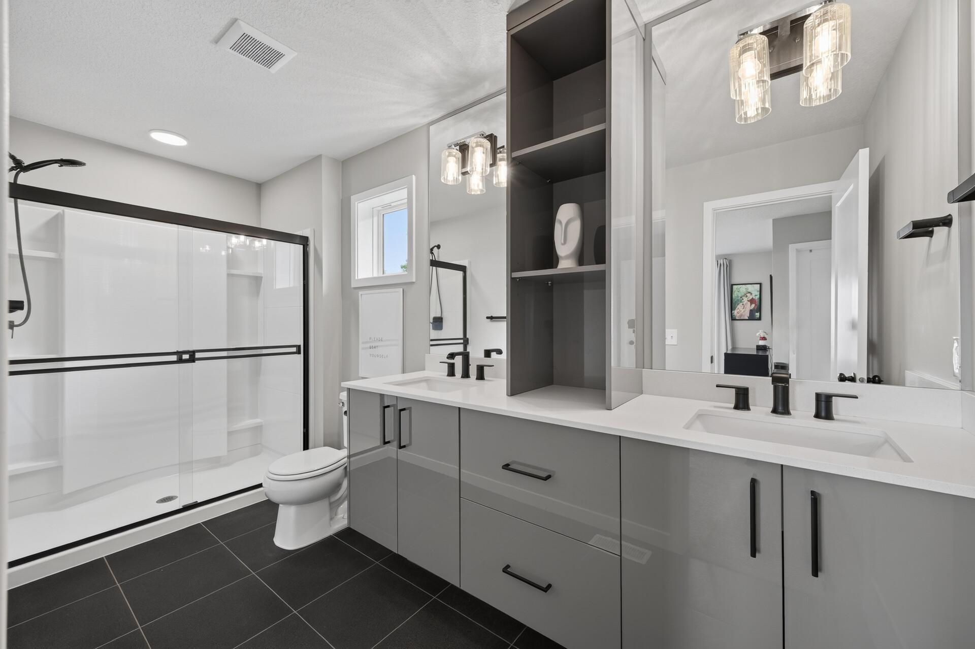 Primary en-suite with dual vanity and great storage.