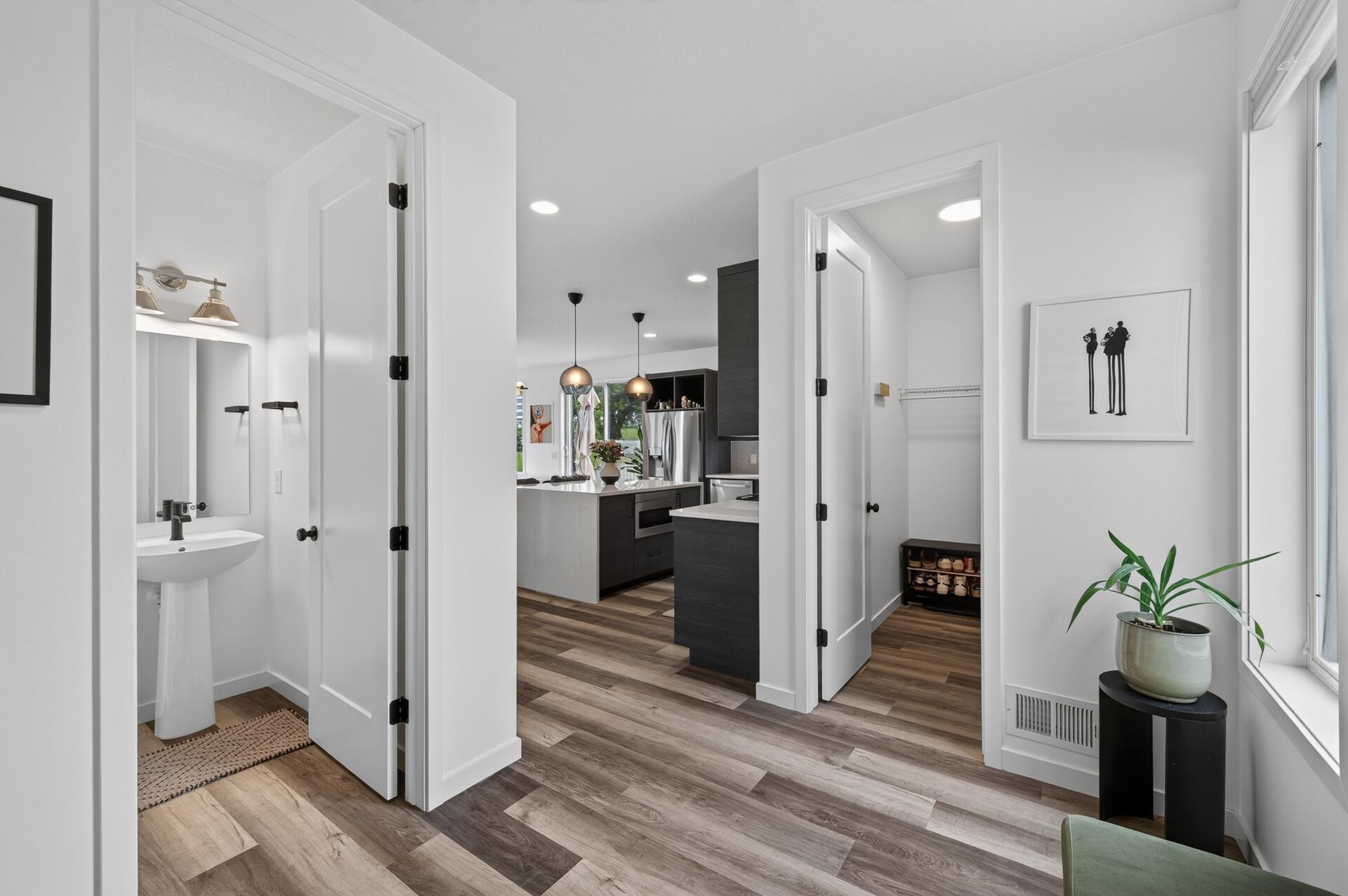 View from corner of mudroom, powder bath and walk-in coat closet.
