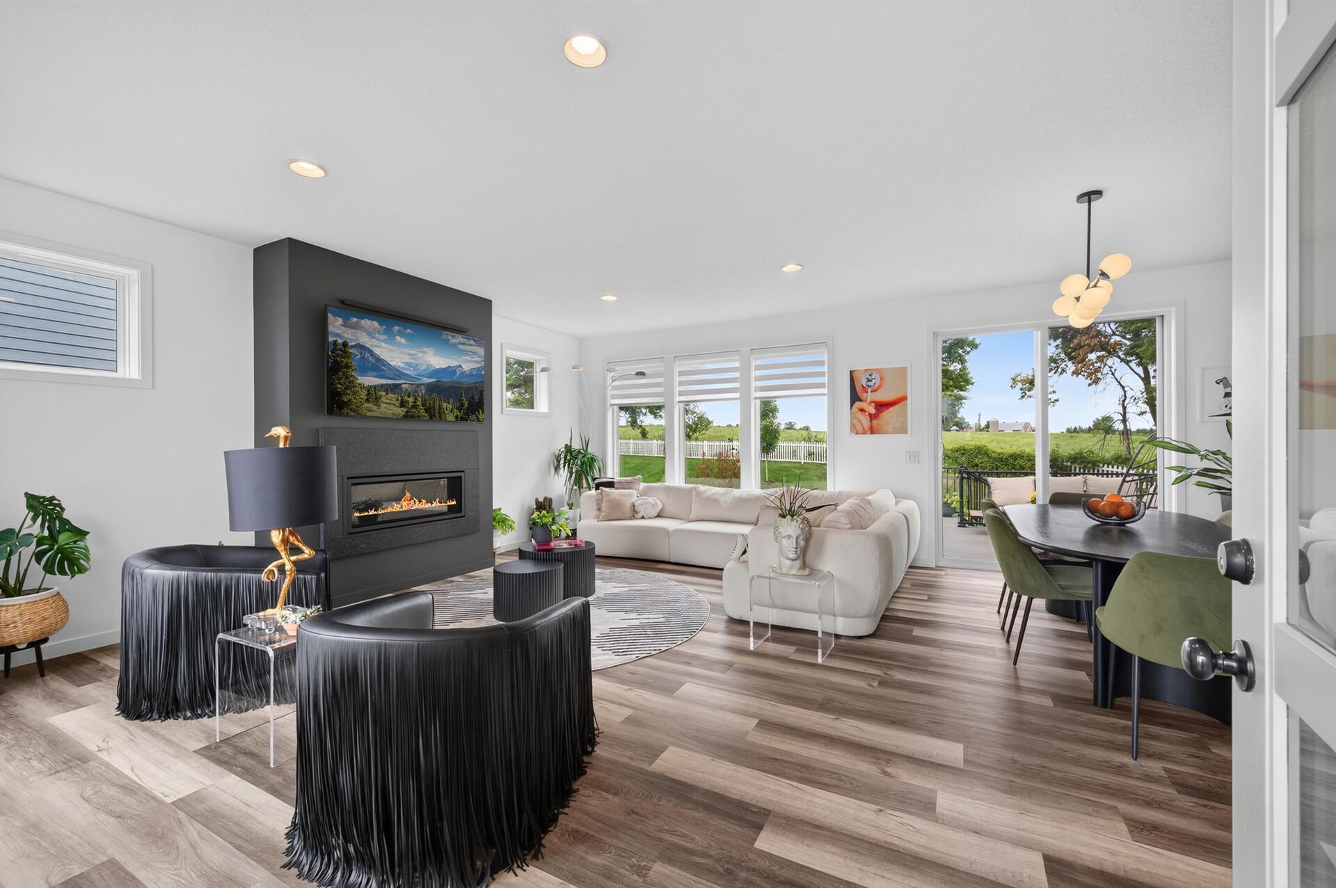 Extra tall patio door and front door PLUS floor to ceiling windows on the front and back of living room for ample natural light!