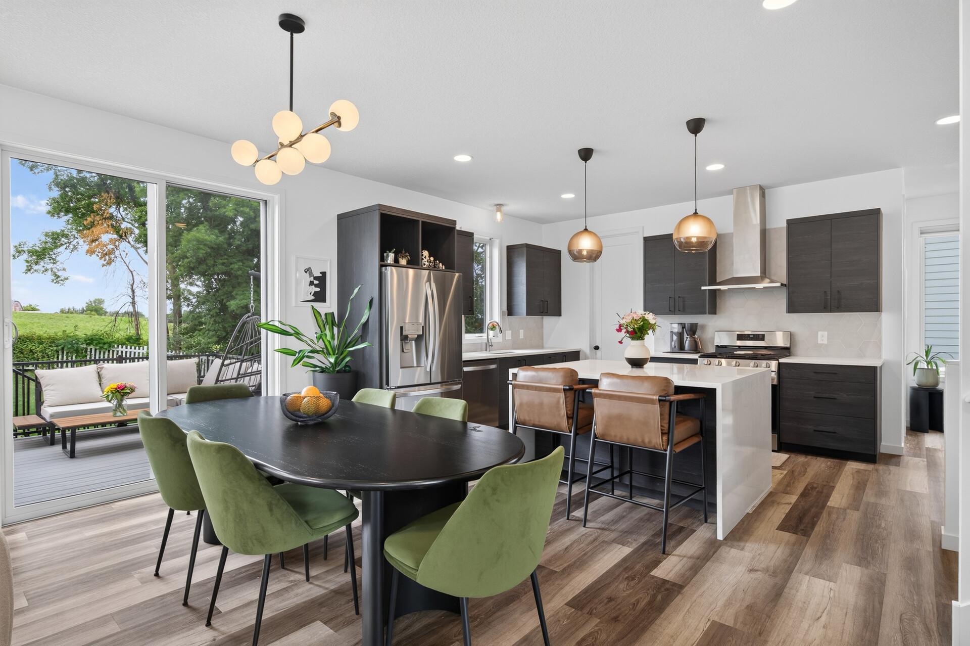 Featuring a dramatic waterfall island, gas stove and walk-in pantry.