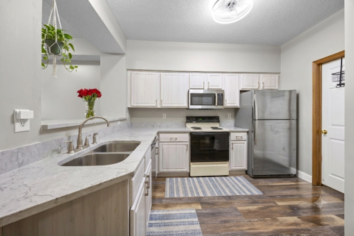 Newer quartz countertops! Beautiful LVP flooring. (Virtual staging has been used to help highlight this home's features)