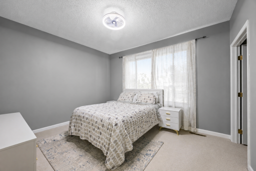 Main level primary with walk-in closet and private, 3/4 bathroom. Modern colors, neutral flooring, white trim and large window brings in a ton of natural light. (Virtual staging has been used to help highlight this home's features)