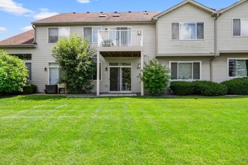 Walkout from main level to gorgeous fabulous patio with grassy, green space views!