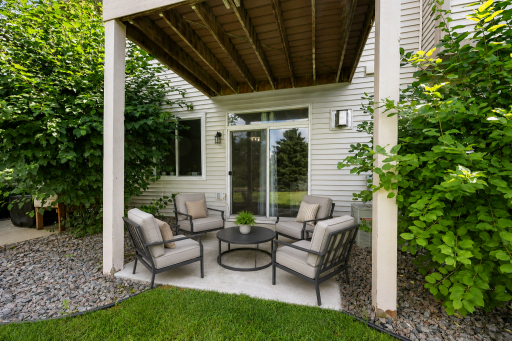 Great backyard patio space! (Virtually staged to imagine a cozy, walkout patio space overlooking green space).