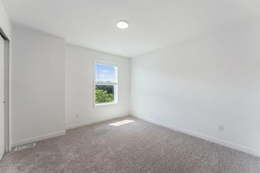 (Photo of a similar home, actual finishes may vary) All bedrooms are located on the second level for enhanced privacy.