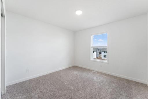 (Photo of a similar home, actual finishes may vary) With four bedrooms, this home is ideal for growing households or anyone looking for more space.