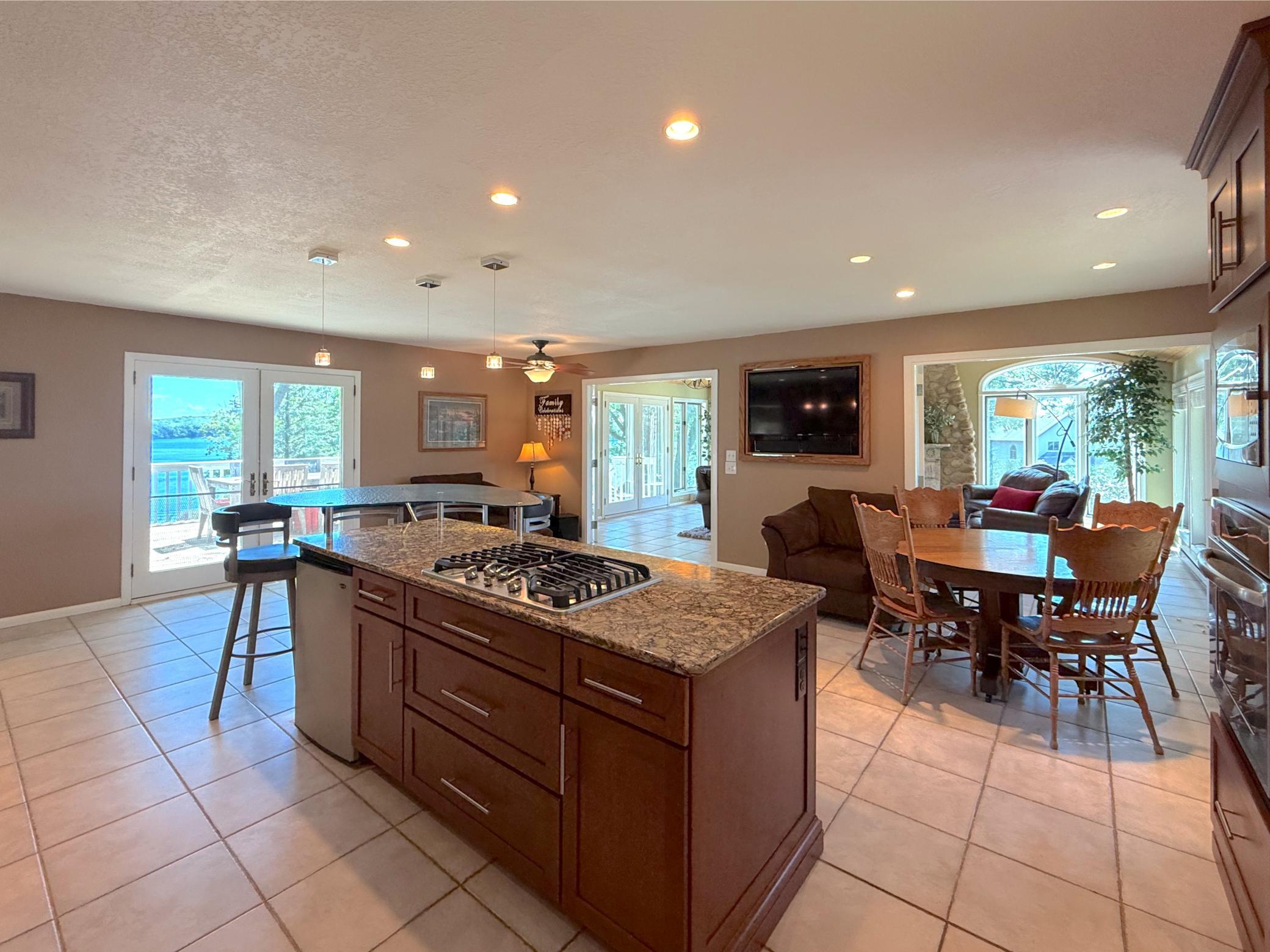 The home's thoughtful layout offers an effortless transition from the kitchen into the adjoining living room, creating multiple inviting spaces to gather with all your guests.