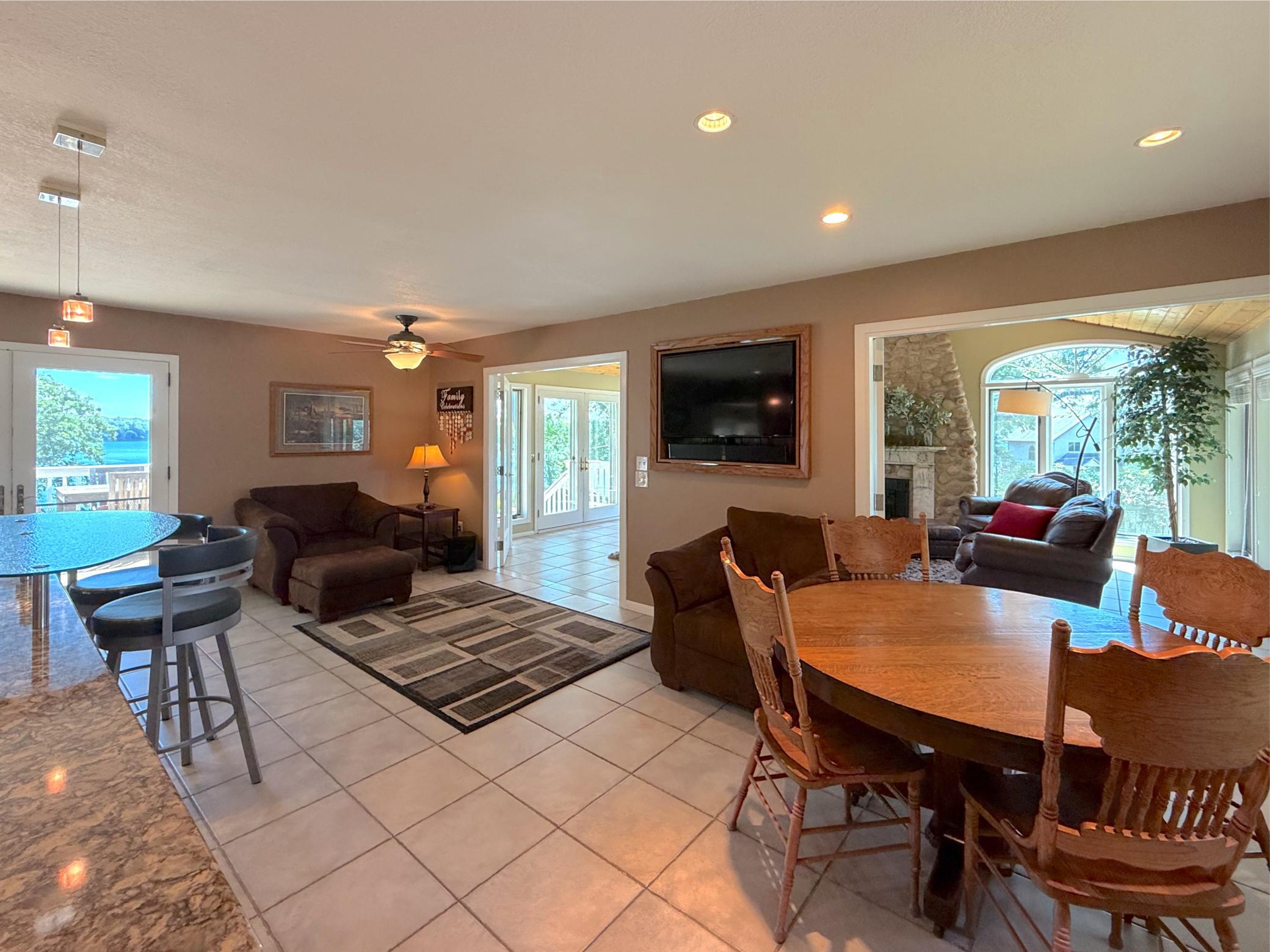 The heart of the home, the expansive kitchen opens to a comfortable sitting and dining space. Patio doors fill the space with natural light and provide seamless access to the deck.