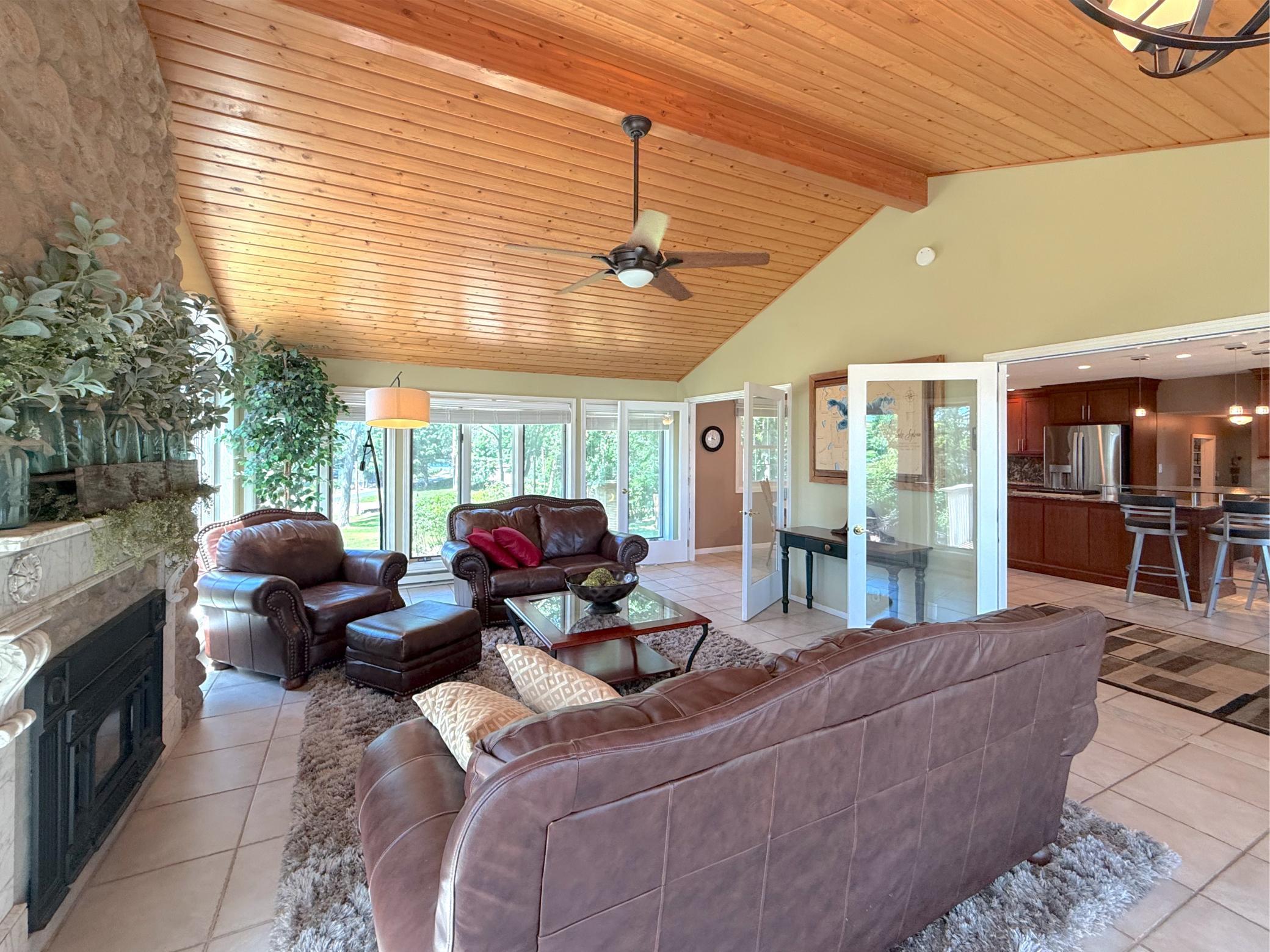 French doors create a seamless connection between the living room and kitchen, making this home ideal for entertaining with easy flow from room to room.