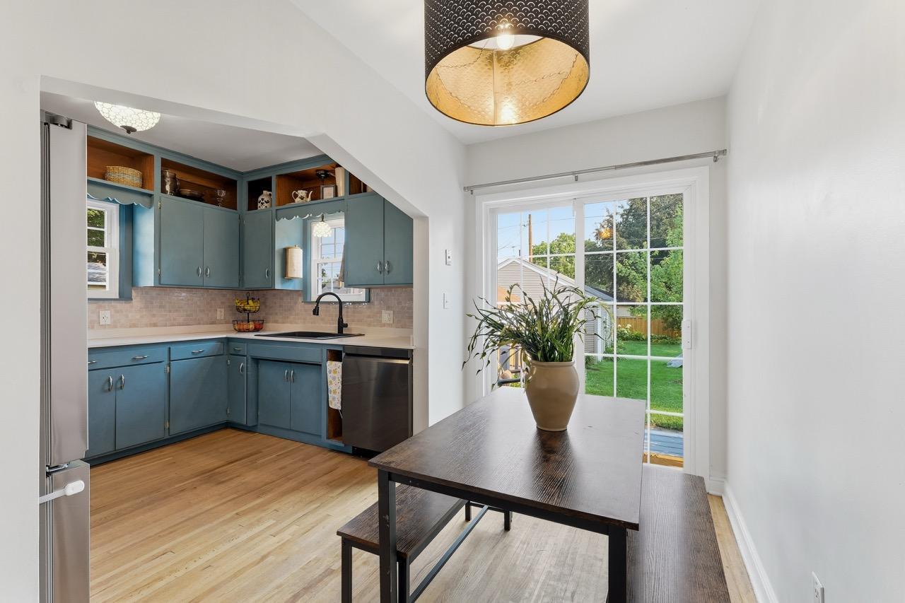 View of Dining Room and Kitchen with view of back yard through the sliding door