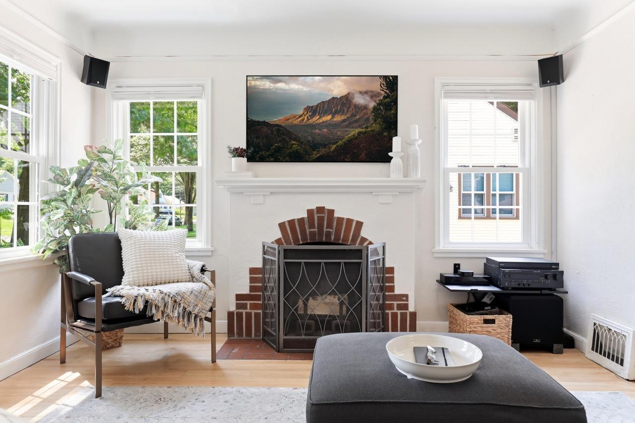 Original Brick Fireplace with tastefully integrated 5.1 Surround sound system for immersive movie expeirence with the Samsung TheFrame Smart TV.