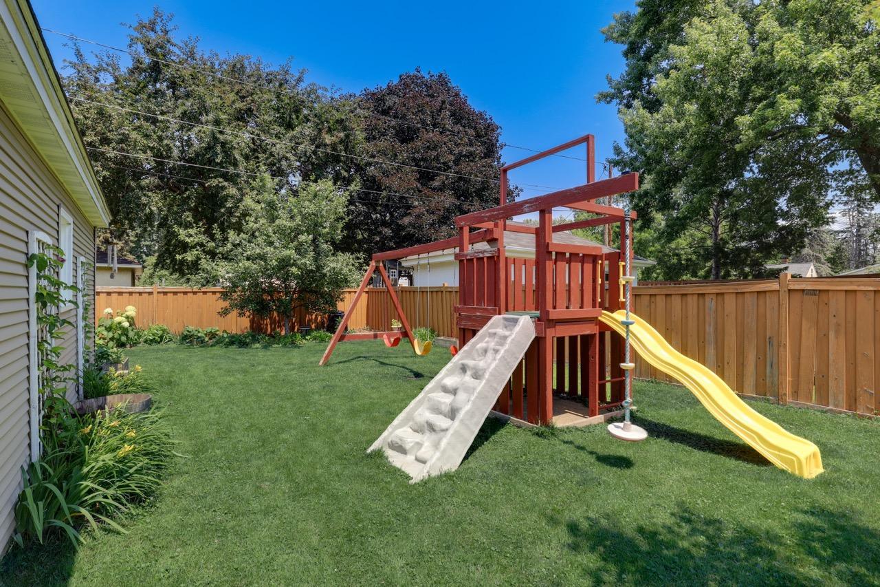 view of backyard near garage and facing northeast towards apple tree at the back of the lot.