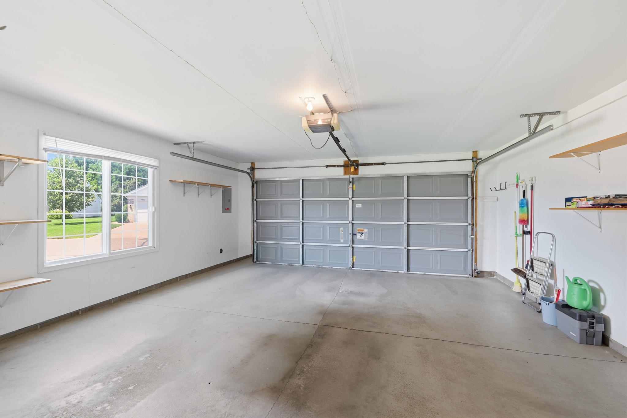 Insulated two-car garage with convenient direct access to the kitchen, offering everyday ease for unloading groceries and staying comfortable year-round.