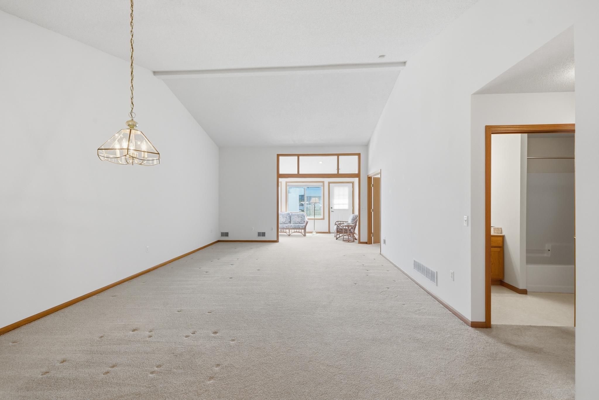 Expansive open-concept living and dining area designed for both everyday comfort and effortless entertaining. The generous layout offers seamless flow between spaces, enhanced by abundant natural light and clean, uncluttered sightlines.