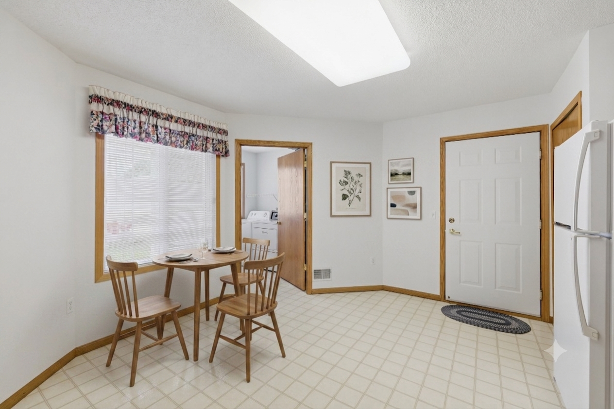 Virtually stagged kitchen. There is plenty of room for a table and four chairs.