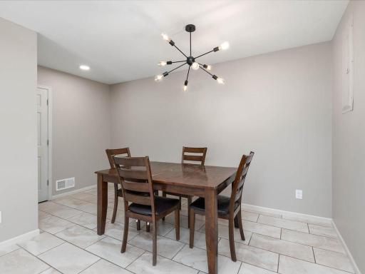 Lower-level dining area provides dedicated space near the second kitchen and adjoining living areas.
