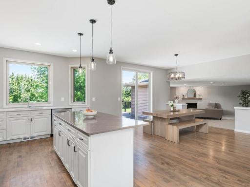 Lg ctr island provides additional prep space and seating while the kitchen remains open to the adjoining dining and living areas.