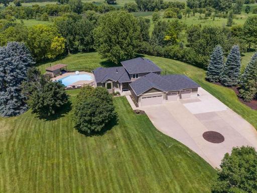 Welcome to this impressive St. Michael acreage property offering 5 bdrms, 4 baths, 3,598 fsf, private in-ground pool, outdoor sauna, and heated 4-car garage on 2.023 acres.