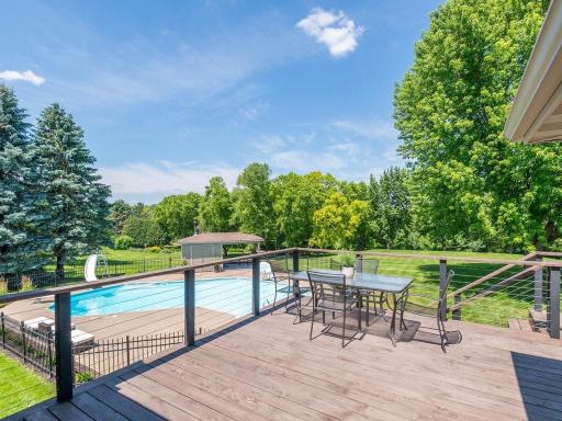 Reconstructed cedar deck overlooks the private pool and provides elevated space for outdoor dining and relaxation.