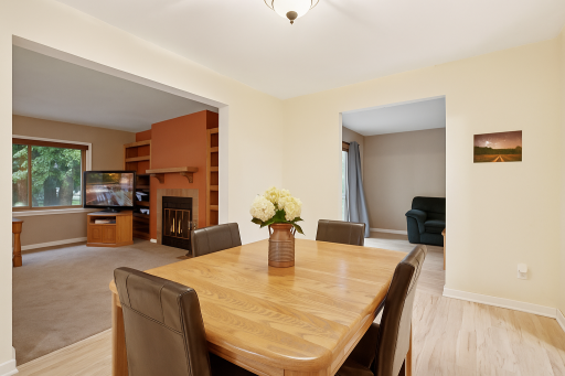 Formal Dining off of Kitchen/Livingroom and steps to den area.