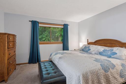 Primary Bedroom with 3/4 bathroom and walk in closet