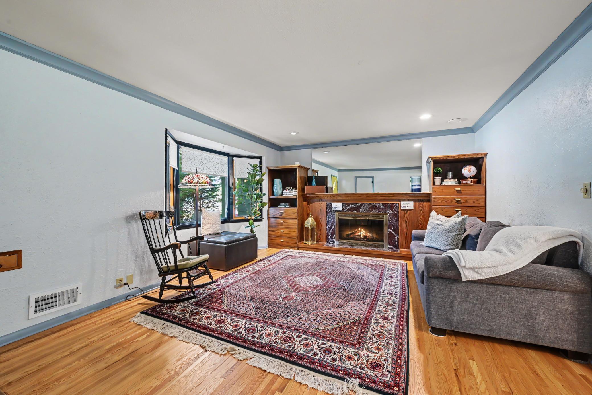 Living Room w/wood burning fireplace and built in shelving