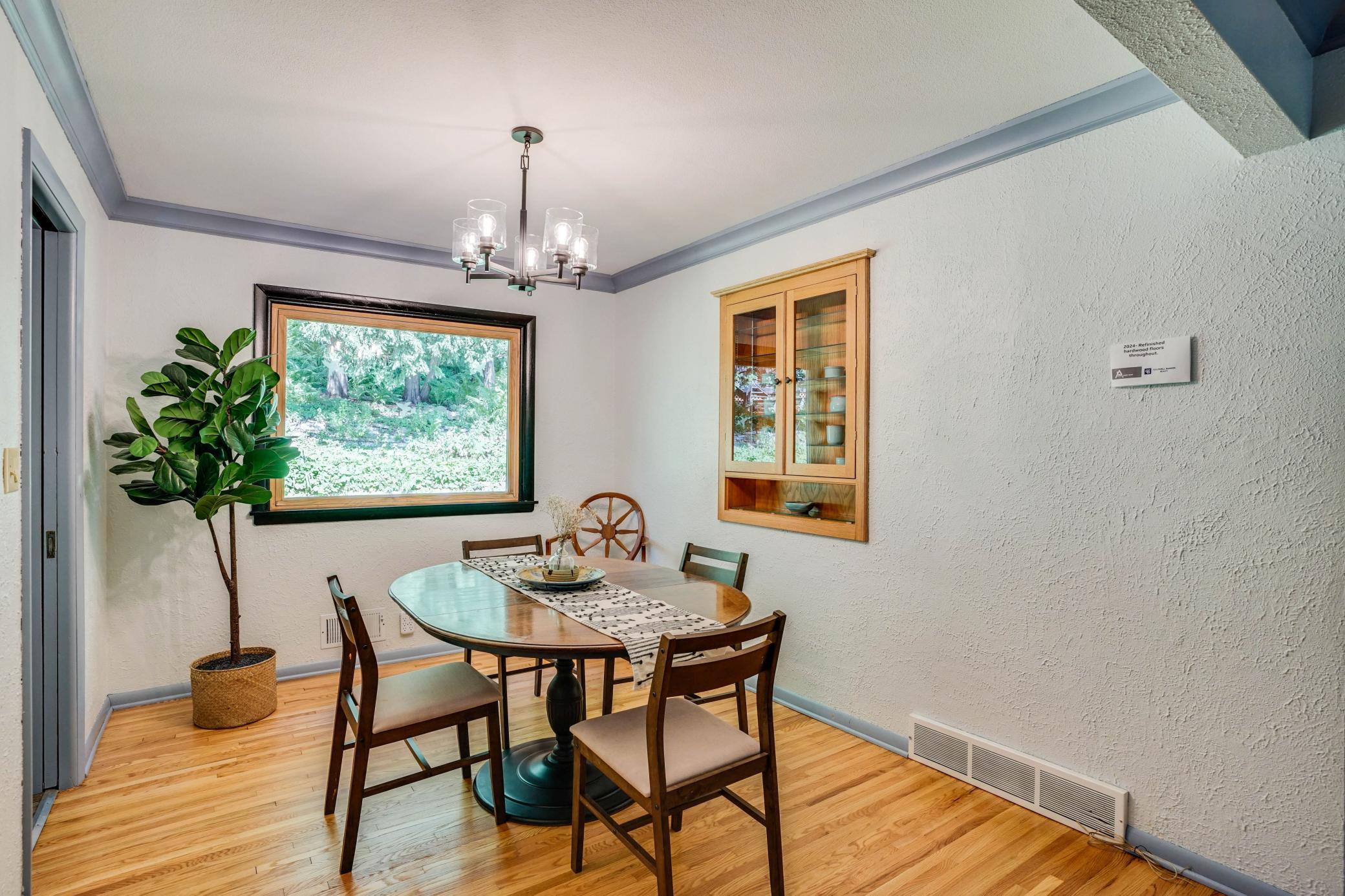 Dining room w/ built-in cabinet