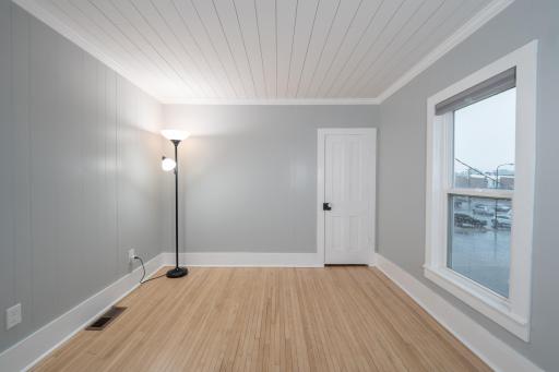 Upper level Bedroom #3 w/beautiful refinished floors and shiplap ceiling