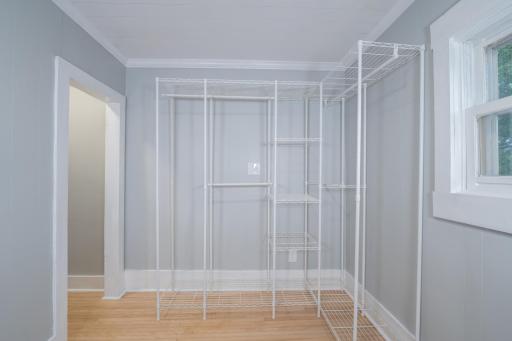 33-Upper level bedroom #4 currently used as laundry room. shelving stays