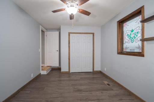 18-Bedroom #1 - Main Floor hardwood floor.jpg