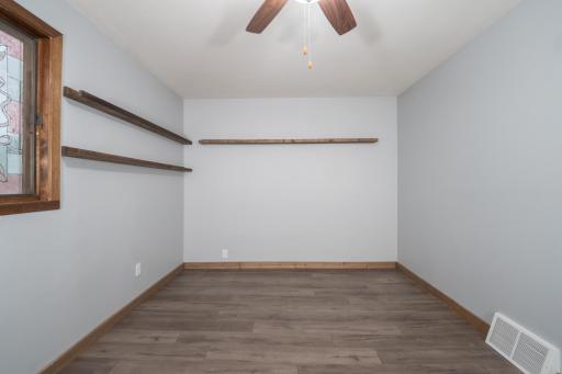 Main floor Bedroom #1. Floating shelves stay