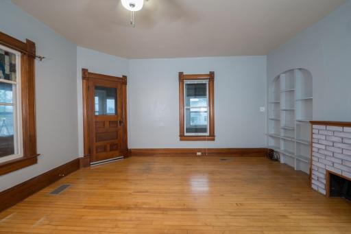 Living Room with wood floors and built in shelves.