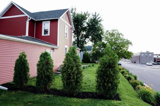 Northside of property with beautiful landscaping. Hudson St. side