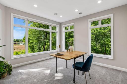 More views, more space, and more possibilities. The walkout lower level features a cozy family room with a gas fireplace and wet bar, a guest bedroom, bathroom, gym, and flexible play space that could easily be converted into an additional bedroom if