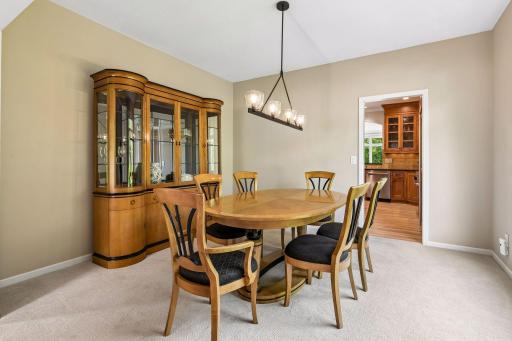 A formal dining room provides the perfect setting for special gatherings, while the adjacent sitting room offers endless possibilities as an enclosed office, library, or flex space.