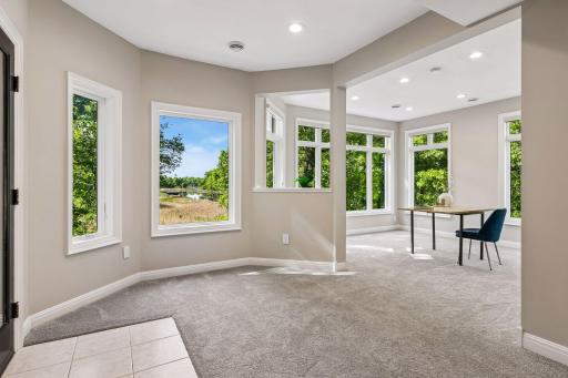 More views, more space, and more possibilities. The walkout lower level features a cozy family room with a gas fireplace and wet bar, a guest bedroom, bathroom, gym, and flexible play space that could easily be converted into an additional bedroom if