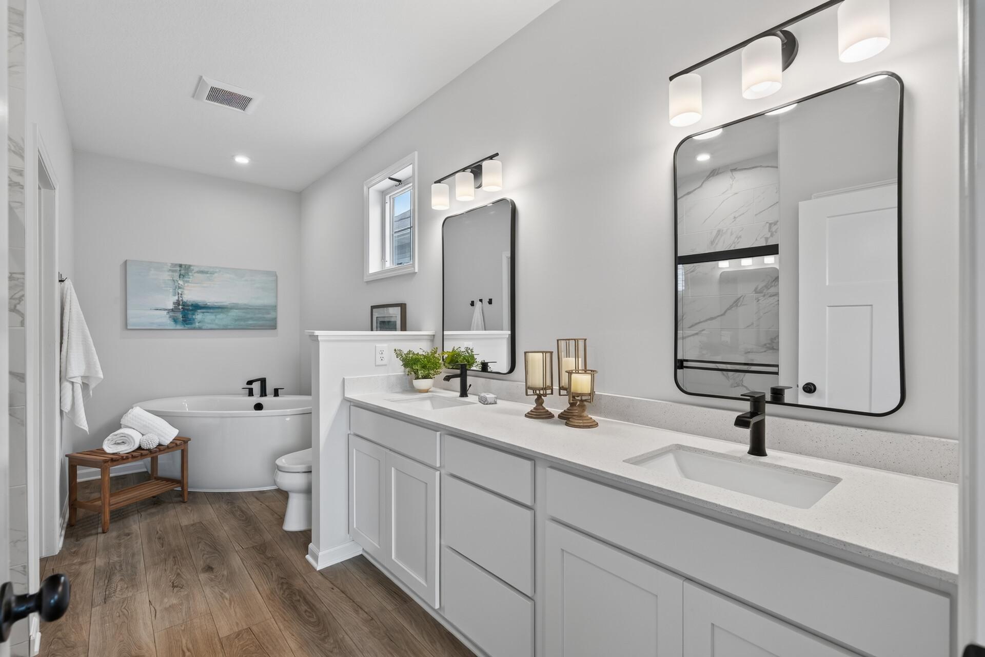 Primary bath with double quartz vanity