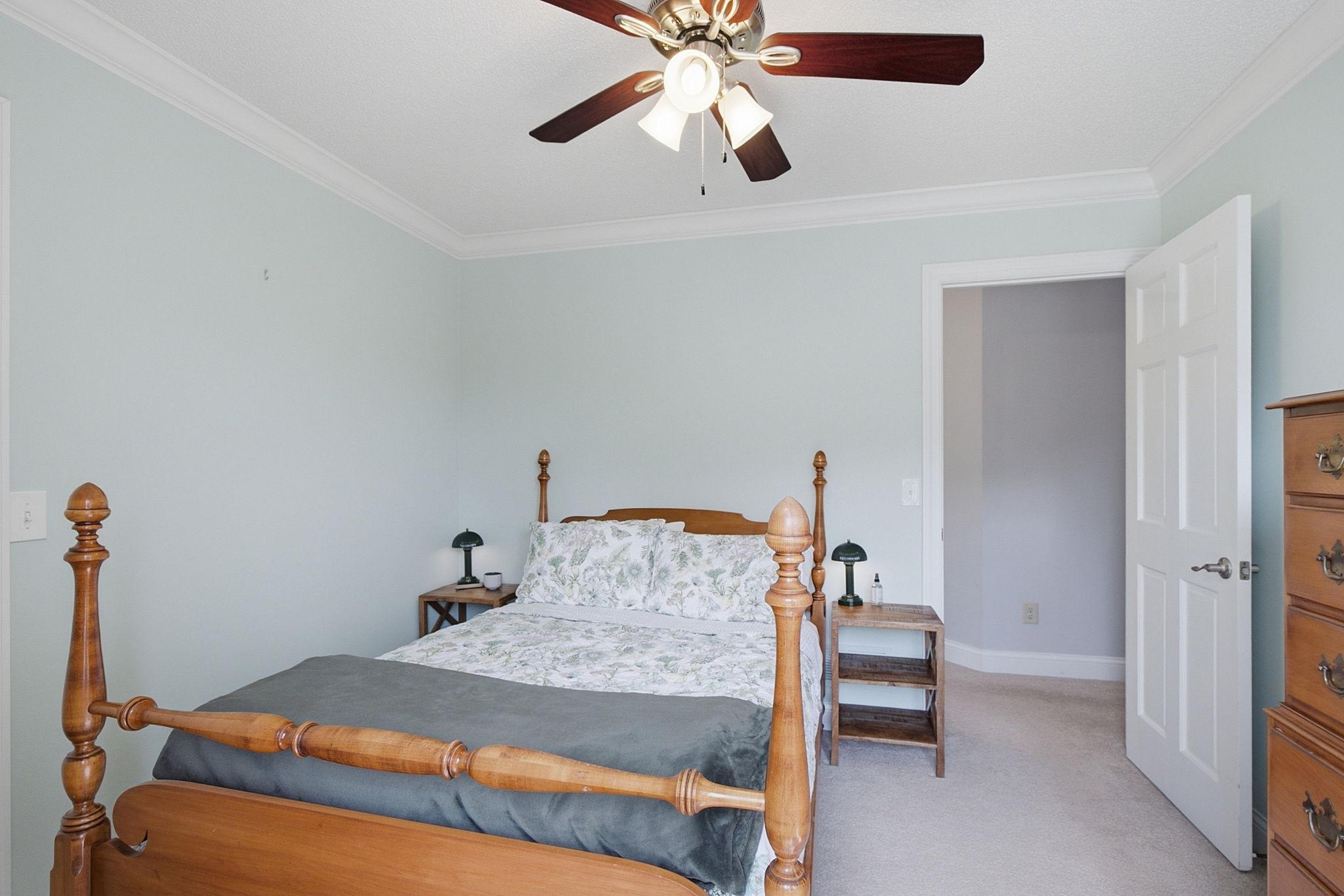 Comfortable secondary bedroom filled with natural light.