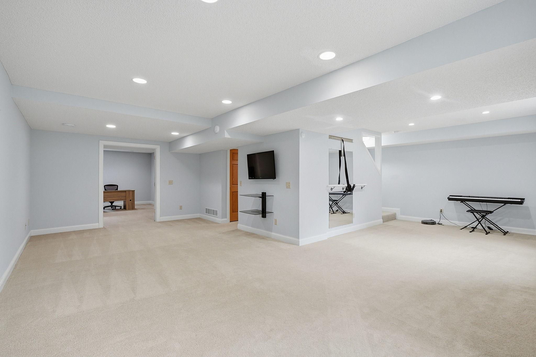 Large family room creates the perfect place to gather, relax, or host guests.